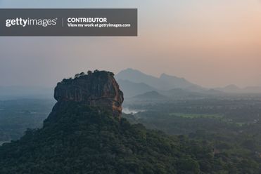 Sigiriya Rock or Lion Rock, seen from Pidurangala rock at sunset